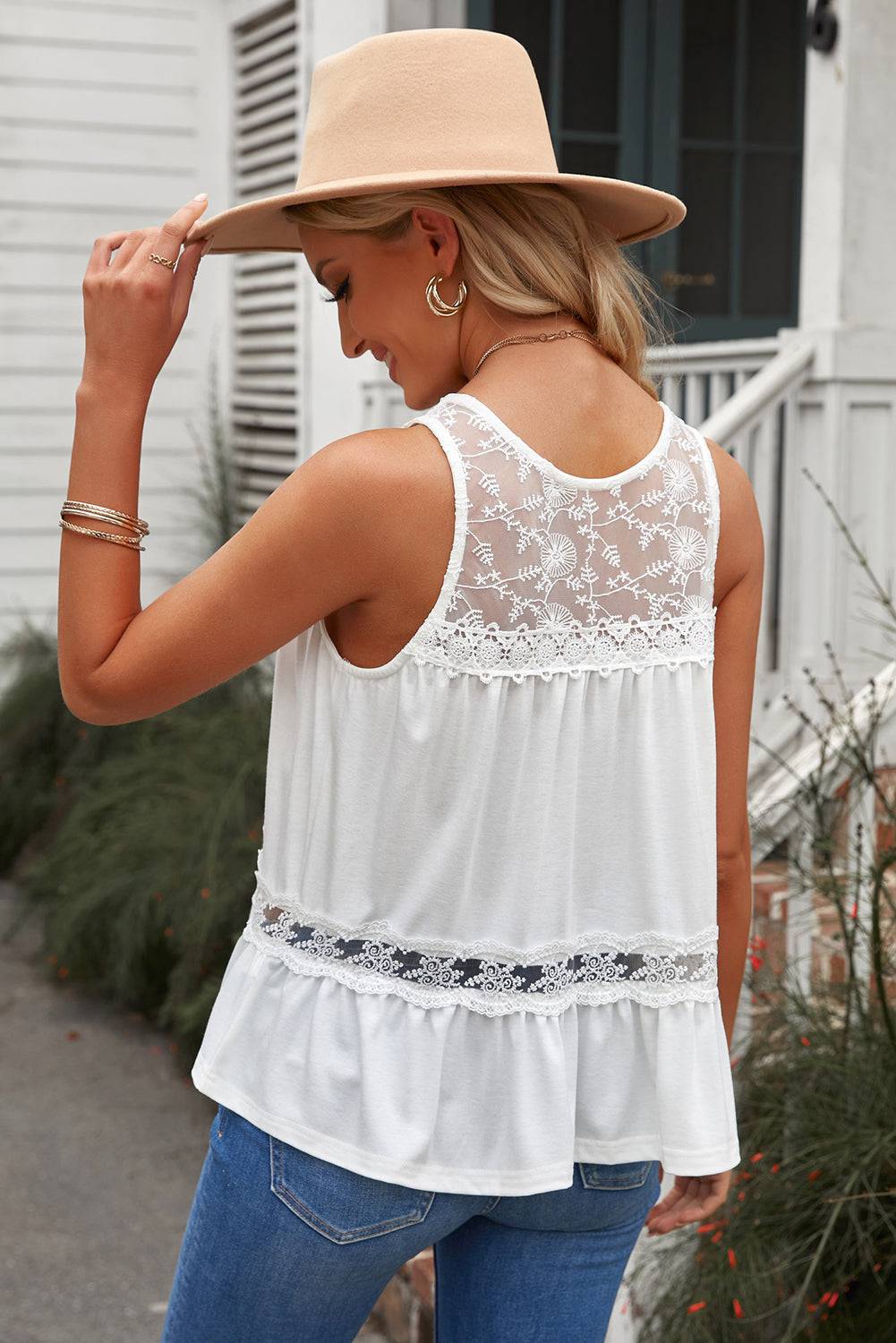 Capture the essence of love with our Lace Yoke Peplum Tank - Indulge in romance and feel like royalty, elegantly accentuating your curves. - Guy Christopher