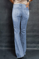 Distressed Raw Hem Flare Jeans - Guy Christopher