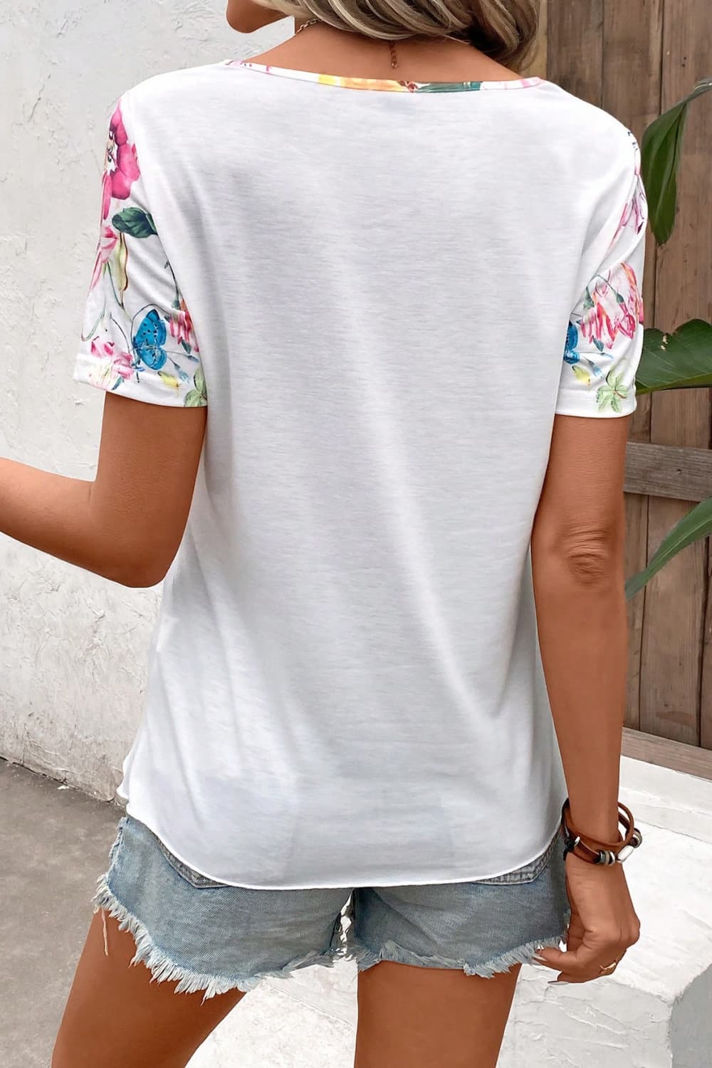 Floral Round Neck Buttoned Hem Detail Top - Guy Christopher