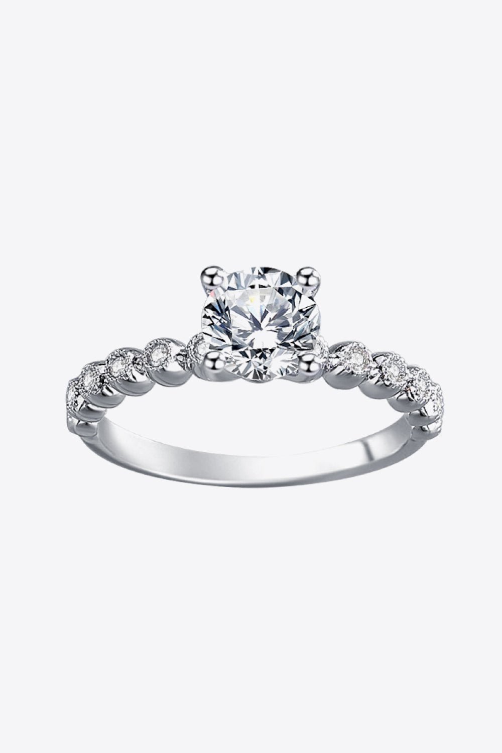 "Forever in Love" - Radiate timeless elegance with our Classic 4-Prong Moissanite Ring and capture the essence of pure love. - Guy Christopher