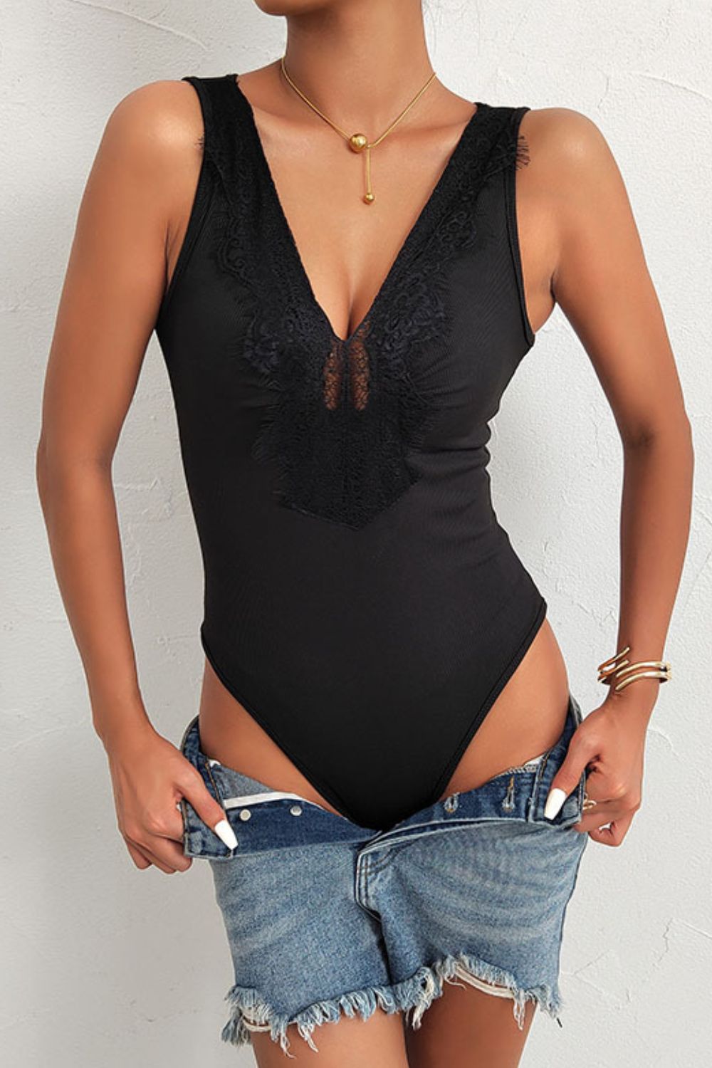 Indulge in Romance with our Spliced Lace Deep V Sleeveless Bodysuit - Embrace your Unique Beauty and Feel Confident in Delicate Luxury. - Guy Christopher