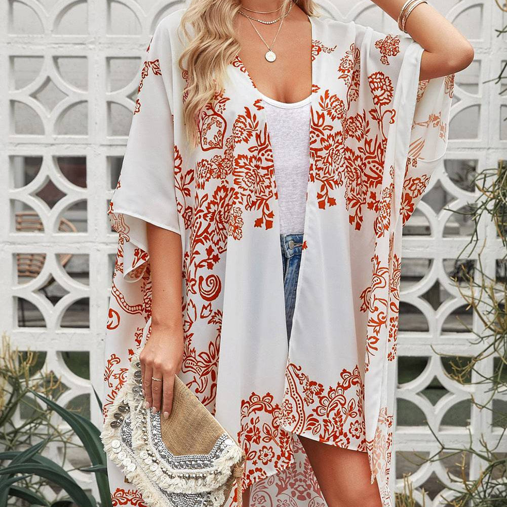 Indulge in the Luxurious Feel of Romance - Our Floral Side Slit Cover Up Will Transport You to a World of Beauty and Elegance, Elevating Your Feminine Style with Every Step. - Guy Christopher
