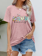 "MAMA BUNNY Easter Graphic Tee - Embrace Love and Joy this Easter Season with our Soft and Sweet Design - Wrap Yourself in Comfortable Elegance" - Guy Christopher