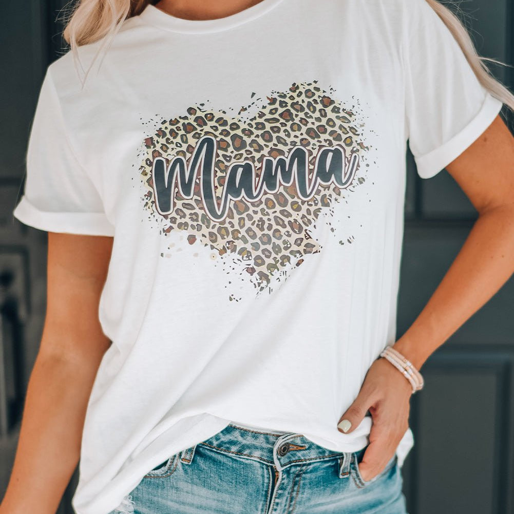 "MAMA Leopard Heart Graphic Tee Shirt - Embrace Your Wild Side and Celebrate the Eternal Bond Between a Mother and Child - Indulge in Graceful Comfort" - Guy Christopher