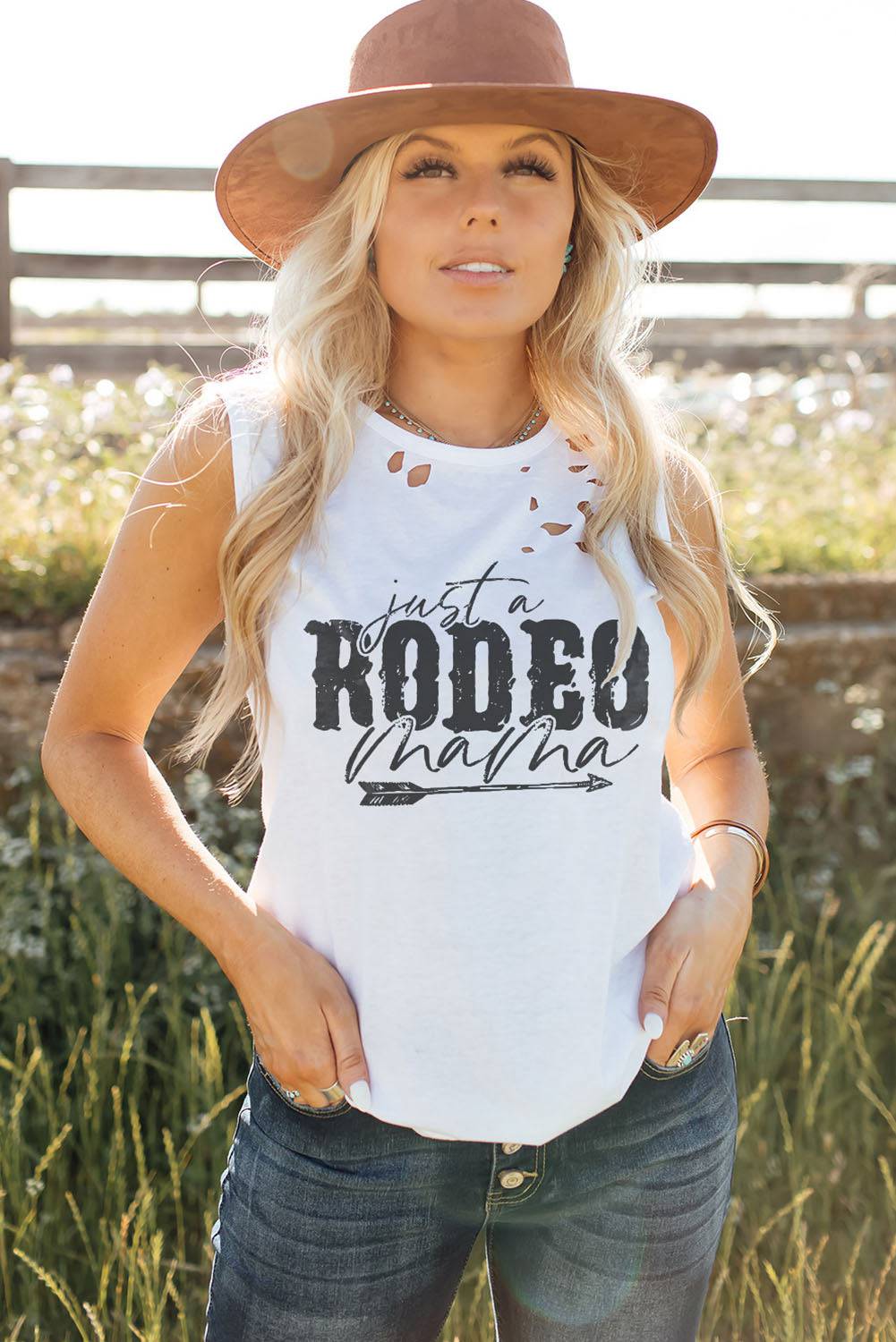 "Unleash Your Inner Country Charm with JUST A RODEO MAMA Graphic Distressed Tank - Let Your Heart Gallop Free in Style and Comfort" - Guy Christopher